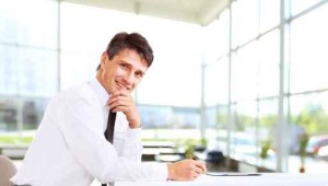 Handsome business man smiling at the office