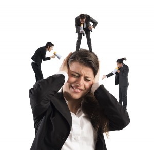 Employees yelling to a businesswoman with megaphone